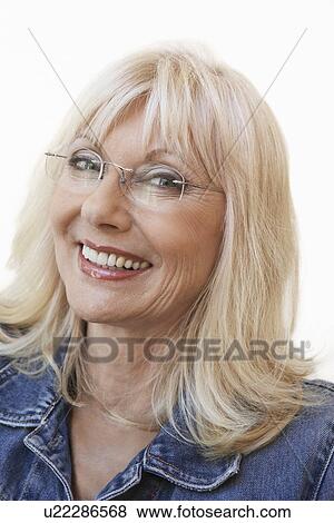Middle aged woman wearing glasses, portrait View Large Photo Image Stock Photo - Middle aged woman wearing glasses, portrait. Fotosearch