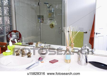 Stock Photograph - Mirror in empty bathroom. Fotosearch