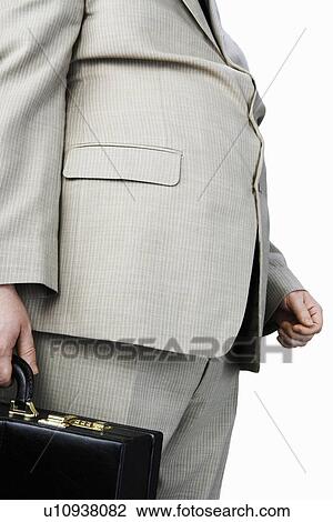 Overweight Man carrying briefcase, mid section, side view View Large Photo Image Stock Image - Overweight Man carrying briefcase, mid section, side view. Fotosearch