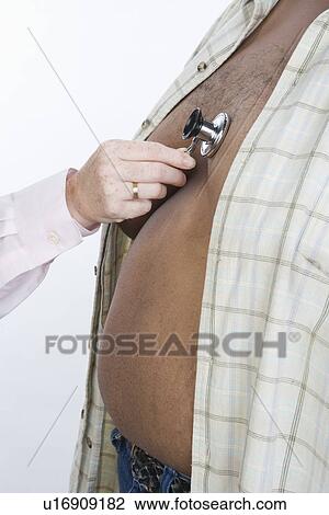 Overweight Man in Medical Examination View Large Photo Image Stock Image - Overweight Man in Medical Examination. Fotosearch