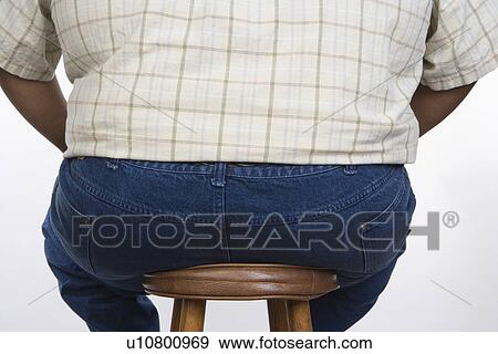 Overweight Man Sitting on Stool View Large Photo Image Stock Photo - Overweight Man Sitting on Stool. Fotosearch