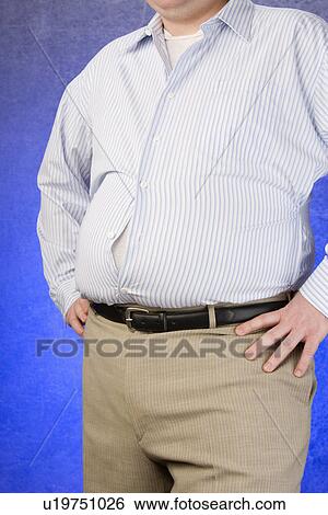 Overweight Man standing with unbuttoned shirt, hands on hip, mid section View Large Photo Image Stock Photograph - Overweight Man standing with unbuttoned shirt, hands on hip, mid section. Fotosearch