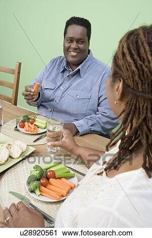 Overweight mid-adult couple having healthy meal View Large Photo Image Stock Image - Overweight mid-adult couple having healthy meal. Fotosearch