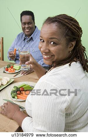 Overweight mid-adult couple having healthy meal View Large Photo Image Stock Photo - Overweight mid-adult couple having healthy meal. Fotosearch