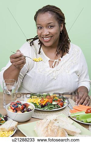 Overweight mid-adult woman having healthy meal View Large Photo Image Stock Image - Overweight mid-adult woman having healthy meal. Fotosearch