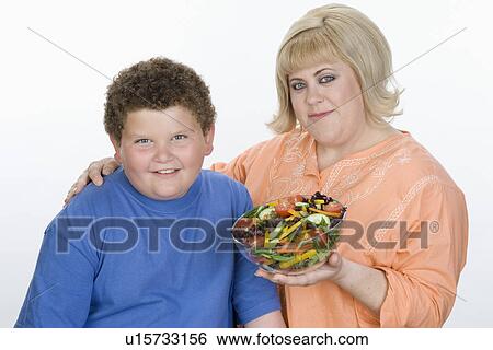 Stock Photograph - Overweight mother with overweight son. Fotosearch