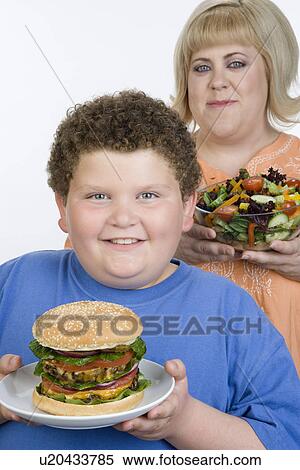 Stock Photography - Overweight mother with overweight son. Fotosearch