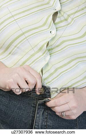 Overweight woman, mid-section View Large Photo Image Stock Photograph - Overweight woman, mid-section. Fotosearch