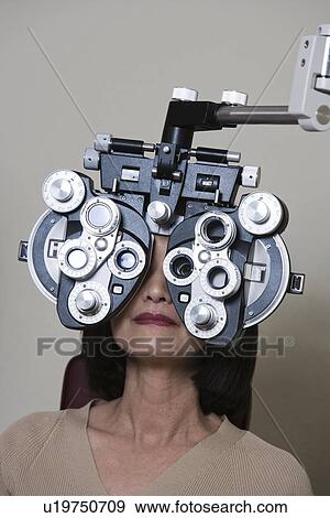 Stock Photo - Patient having eyes examined. Fotosearch