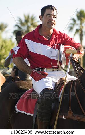 Polo player horseback riding View Large Photo Image Stock Image - Polo player horseback riding. Fotosearch