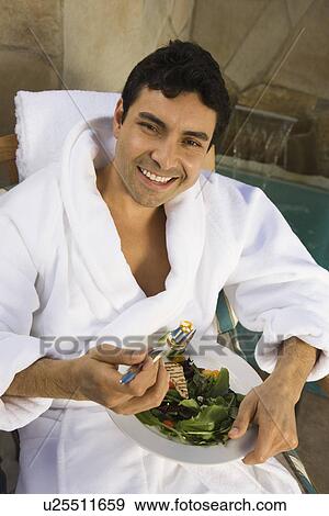 Portrait of man eating healthily outdoors View Large Photo Image Stock Photo - Portrait of man eating healthily outdoors. Fotosearch