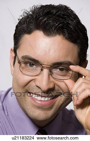 Portrait of man wearing eyeglasses View Large Photo Image Picture - Portrait of man wearing eyeglasses. Fotosearch