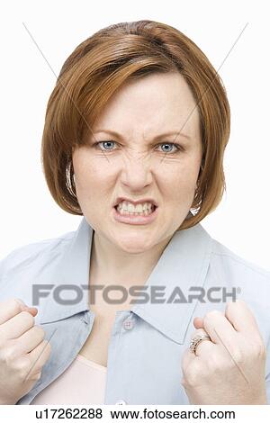 Stock Photo - Portrait of mature woman, grimacing. Fotosearch