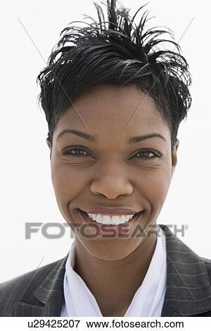 Stock Photo - Portrait of mid-adult African-American businesswoman.. Fotosearch