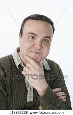 Stock Photo - Portrait of mid-adult man, smiling. Fotosearch