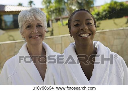 Portrait of two women in bathrobes at health spa View Large Photo Image Picture - Portrait of two women in bathrobes at health spa. Fotosearch