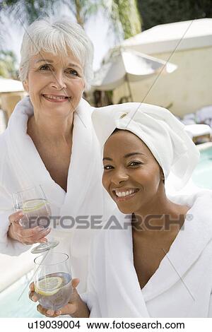 Picture - Portrait of two women in bathrobes at health spa. Fotosearch