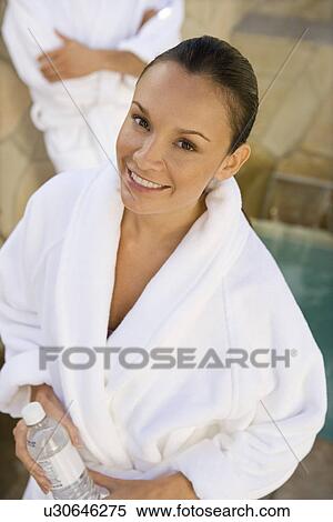 Stock Photography - Portrait of woman in bathrobe outdoors. Fotosearch
