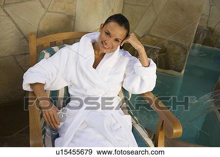 Portrait of woman relaxing by pool View Large Photo Image Stock Photo - Portrait of woman relaxing by pool. Fotosearch
