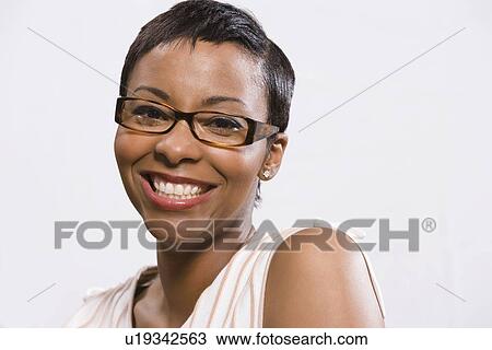 Portrait of woman wearing eyeglasses View Large Photo Image Stock Image - Portrait of woman wearing eyeglasses. Fotosearch