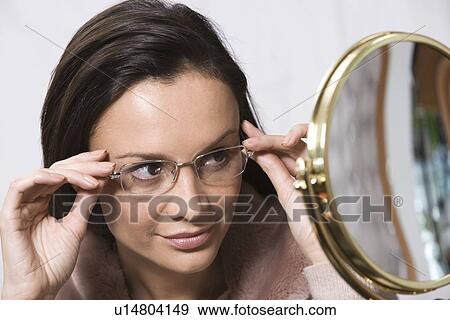 Portrait of woman wearing eyeglasses View Large Photo Image Stock Photo - Portrait of woman wearing eyeglasses. Fotosearch
