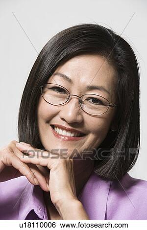 Stock Photograph - Portrait of woman wearing eyeglasses. Fotosearch