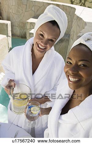 Portrait of women holding drinks, outdoors View Large Photo Image Stock Image - Portrait of women holding drinks, outdoors. Fotosearch