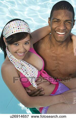 Portrait of Young Couple in Pool View Large Photo Image Stock Photo - Portrait of Young Couple in Pool. Fotosearch