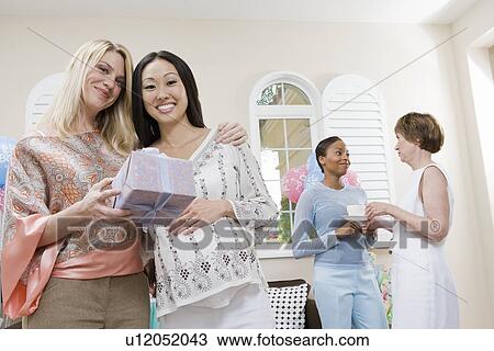Pregnant Asian Woman with friend at a Baby Shower View Large Photo Image Stock Image - Pregnant Asian Woman with friend at a Baby Shower. Fotosearch