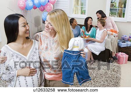Pregnant Asian Woman with friend at a Baby Shower View Large Photo Image Stock Photo - Pregnant Asian Woman with friend at a Baby Shower. Fotosearch