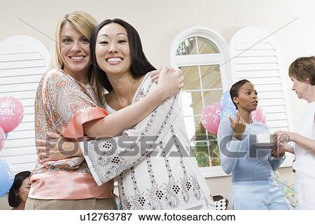 Pregnant Asian Woman with friend at a Baby Shower View Large Photo Image Stock Photo - Pregnant Asian Woman with friend at a Baby Shower. Fotosearch