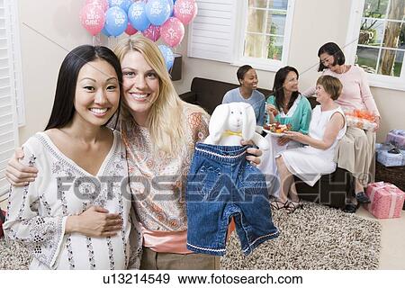 Pregnant Asian Woman with friend at a Baby Shower View Large Photo Image Stock Photo - Pregnant Asian Woman with friend at a Baby Shower. Fotosearch
