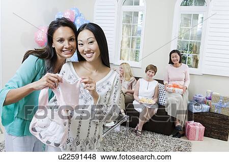 Pregnant Asian Woman with friend at a Baby Shower View Large Photo Image Stock Photo - Pregnant Asian Woman with friend at a Baby Shower. Fotosearch