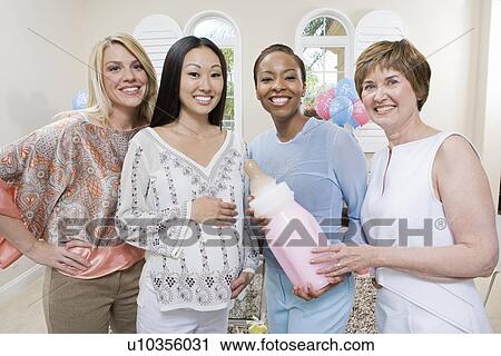 Stock Image - Pregnant Asian Woman with friends at a Baby Shower. Fotosearch