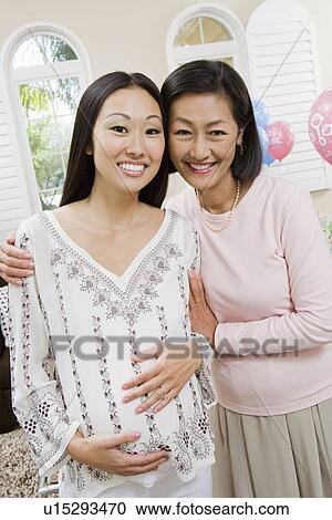 Pregnant Asian Woman with Mother at a Baby Shower View Large Photo Image Stock Image - Pregnant Asian Woman with Mother at a Baby Shower. Fotosearch