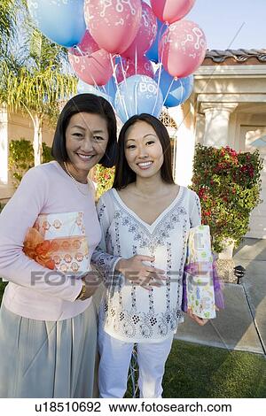 Pregnant Asian Woman with Mother at a Baby Shower View Large Photo Image Stock Image - Pregnant Asian Woman with Mother at a Baby Shower. Fotosearch