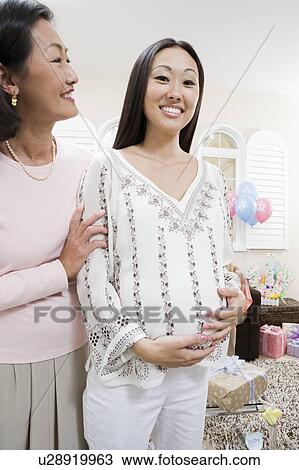 Pregnant Asian Woman with Mother at a Baby Shower View Large Photo Image Stock Image - Pregnant Asian Woman with Mother at a Baby Shower. Fotosearch