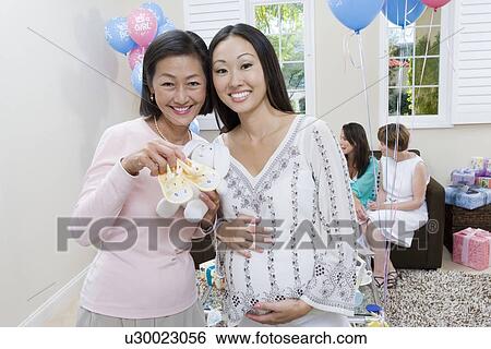 Pregnant Asian Woman with Mother at a Baby Shower View Large Photo Image Stock Photograph - Pregnant Asian Woman with Mother at a Baby Shower. Fotosearch