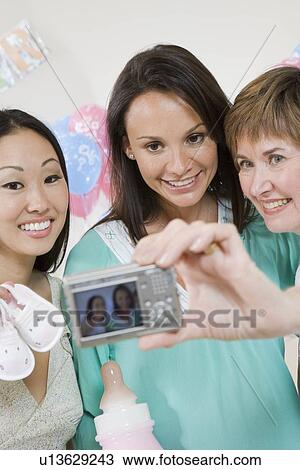 Pregnant Woman with Friends at a Baby Shower View Large Photo Image Stock Image - Pregnant Woman with Friends at a Baby Shower. Fotosearch