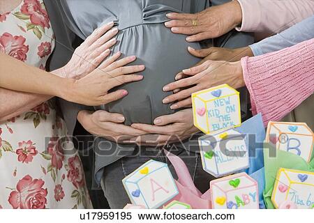 Pregnant Woman with friends at a Baby Shower, Mid Section View Large Photo Image Stock Photography - Pregnant Woman with friends at a Baby Shower, Mid Section. Fotosearch