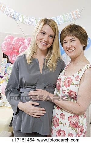 Pregnant Woman with Mother at a Baby Shower View Large Photo Image Picture - Pregnant Woman with Mother at a Baby Shower. Fotosearch