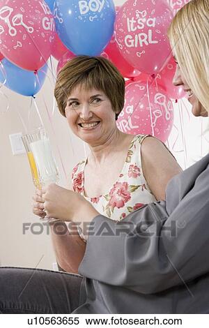 Stock Photography - Pregnant Woman with Mother at a Baby Shower. Fotosearch