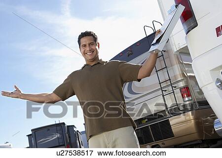 Salesperson on RV lot, portrait View Large Photo Image Stock Photo - Salesperson on RV lot, portrait. Fotosearch