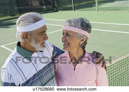 Senior couple on tennis court View Large Photo Image Stock Image - Senior couple on tennis court. Fotosearch