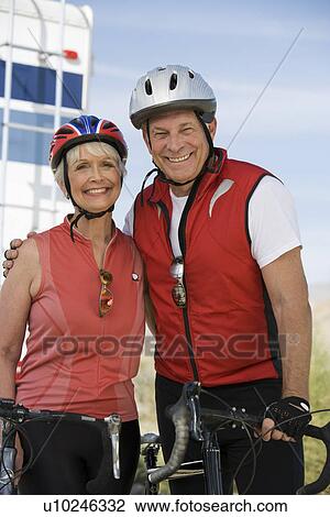 Stock Image - Senior couple with bikes. Fotosearch