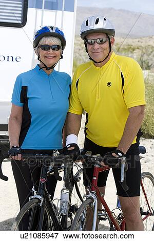 Senior couple with bikes View Large Photo Image Stock Photo - Senior couple with bikes. Fotosearch