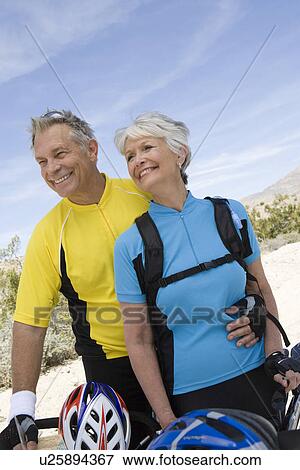 Stock Photo - Senior couple with bikes. Fotosearch