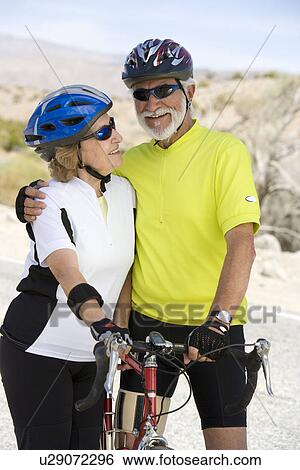 Senior couple with bikes View Large Photo Image Stock Photograph - Senior couple with bikes. Fotosearch