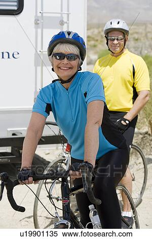 Stock Photography - Senior couple with bikes. Fotosearch