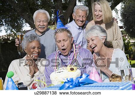 Senior couples celebrating birthday party in garden View Large Photo Image Stock Photo - Senior couples celebrating birthday party in garden. Fotosearch